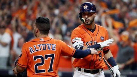 Jose Altuve #27 of the Houston Astros celebrates