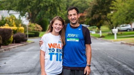 Michael Ehrlich, with daughter Rachael, 13, near their