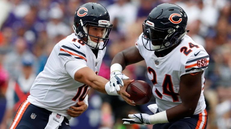 Quarterback Mitchell Trubisky of the Bears hands off