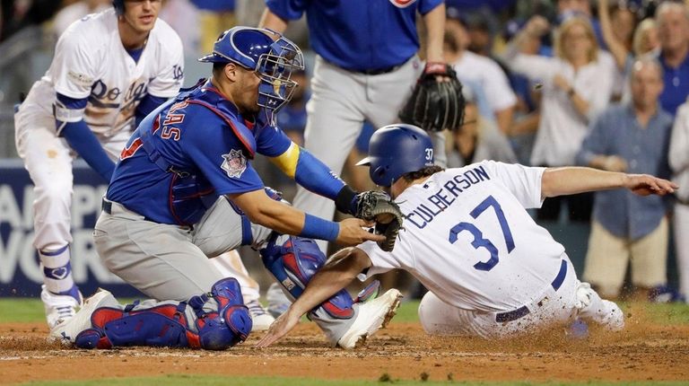 The Dodgers' Charlie Culberson is called safe at