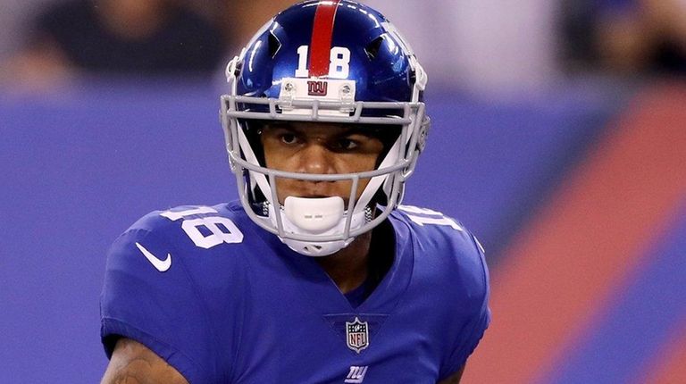 Roger Lewis Jr. of the Giants celebrates a first