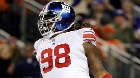 Giants defensive tackle Damon Harrison reacts after sacking