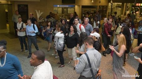 Commuters waiting for a train.