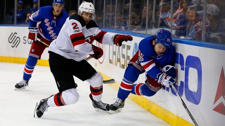 Rangers forward Mats Zuccarello is checked into the