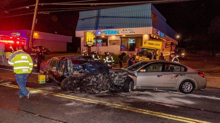 Emergency responders work at the scene of the