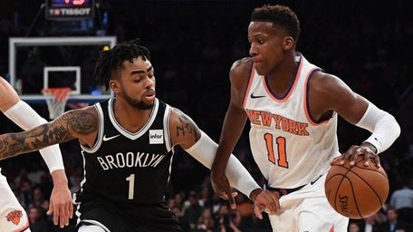 Knicks guard Frank Ntilikina is defended by Brooklyn