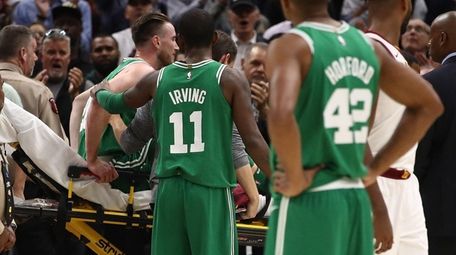 Celtics guard Kyrie Irving consoles Gordon Hayward after Hayward