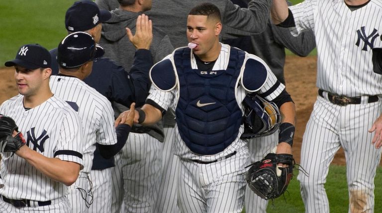The New York Yankees celebrate after defeating the