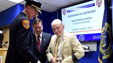 Sean Dixon, 16, with Suffolk County Police Commissioner