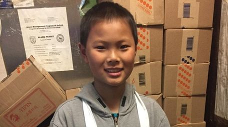 Kidsday reporter Qixin Li at his family's restaurant,