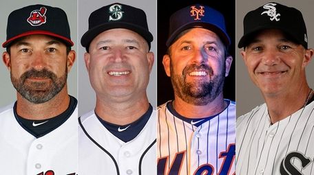 From left, Indians pitching coach Mickey Callaway, Mariners