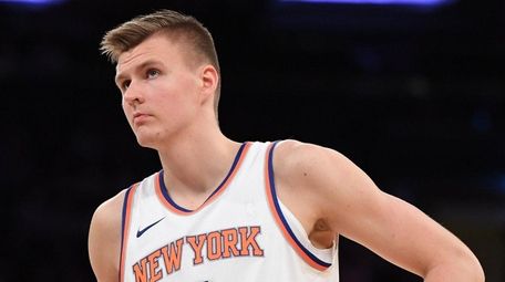 Knicks forward Kristaps Porzingis looks on during a