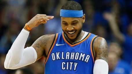 Thunder forward Carmelo Anthony gestures after hitting a