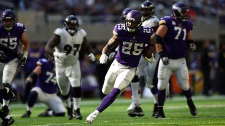 Latavius Murray of the Minnesota Vikings carries the