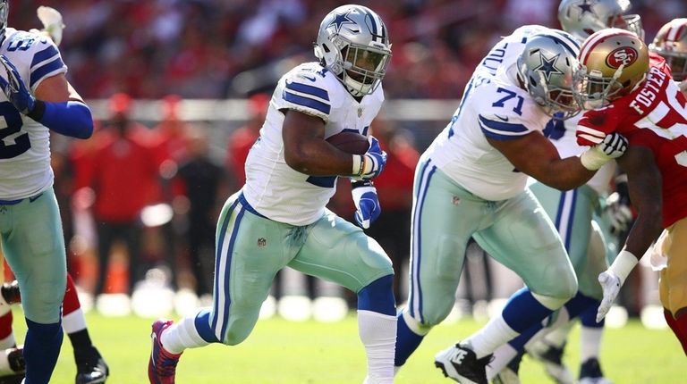 Ezekiel Elliott of the Dallas Cowboys rushes with