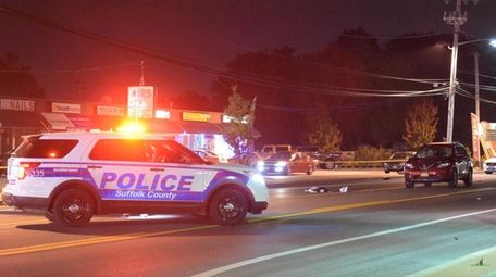 Investigators at the scene where a pedestrian was