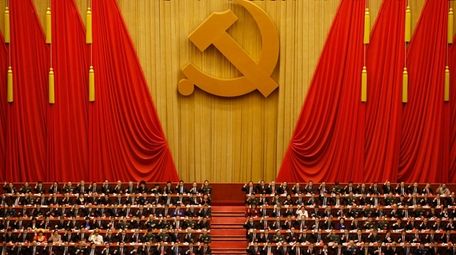 Chinese President Xi Jinping, front row center, leads