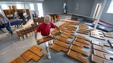 Volunteer Ronnie Gibbs works on the renovation of