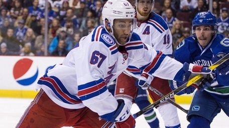Cristoval Nieves of the Rangers skates after a loose puck