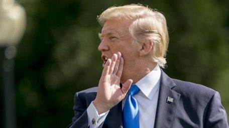 President Donald Trump walks towards Marine One on