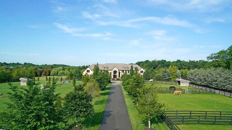The seven-bedroom, nine-bath Mattituck house was previously the