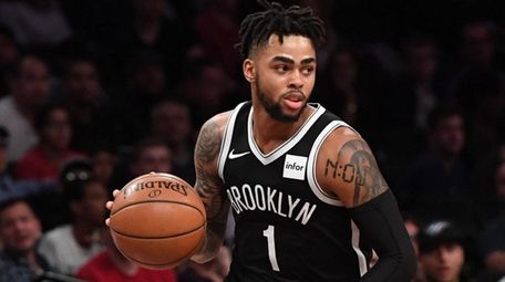 Nets guard D'Angelo Russell controls the ball against