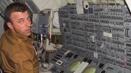 Paul J. Weitz, mans the control and display