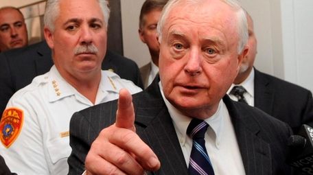 Suffolk County District Attorney Thomas Spota, with then-Chief
