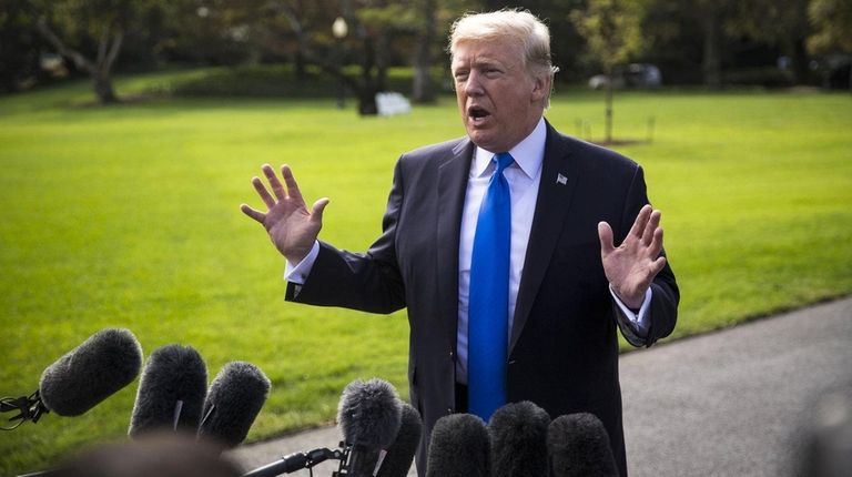 U.S. President Donald Trump speaks to members of