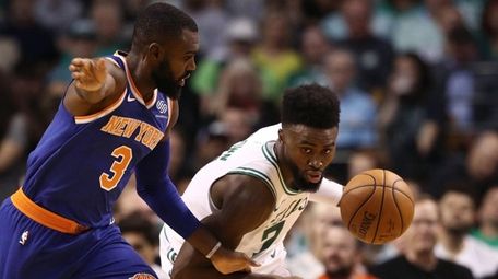 Jaylen Brown of the Celtics drives against Tim
