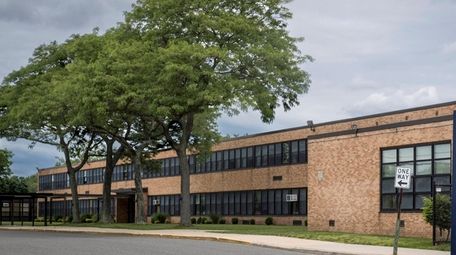 Shallow groundwater monitoring wells on campus outside Bethpage