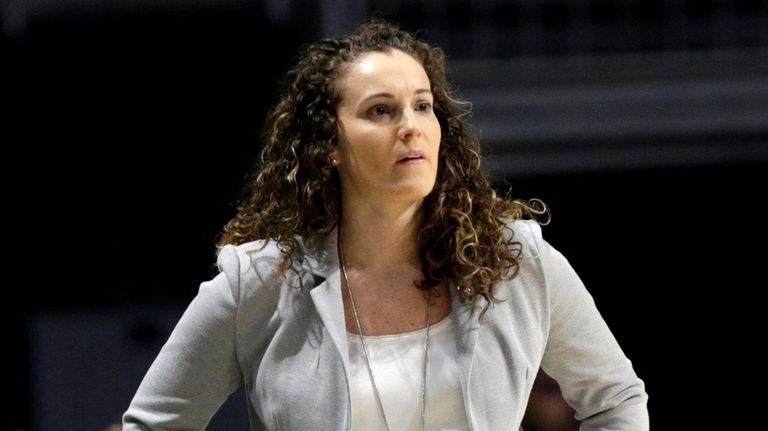 Marquette coach Carolyn Kieger watches during the first