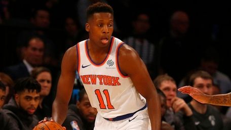 Knicks guard Frank Ntilikina controls the ball in the
