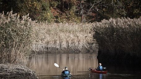 People paddle on the Nissequogue River in Smithtown,
