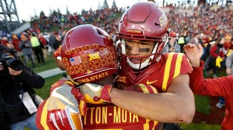 Iowa State wide receiver Allen Lazard, right, celebrates
