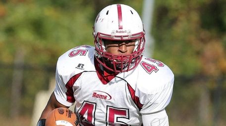 Clarke's Austin Carman runs the ball during a