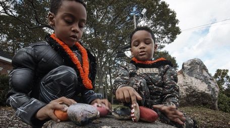 Justin McBean, 6 of Bay Shore, left, and