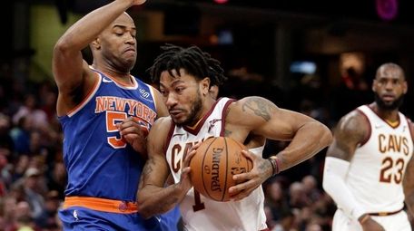 The Cavaliers' Derrick Rose drives to the basket