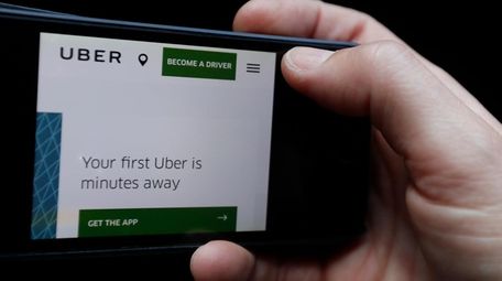 The Uber website is displayed on a phone