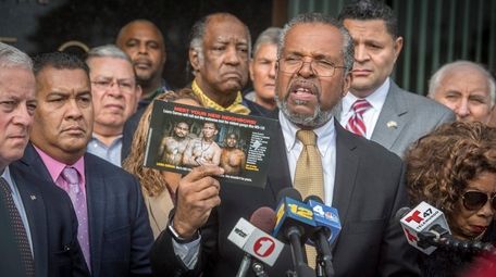 Attorney and activist Fred Brewington holds up a