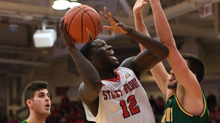 Stony Brook forward Tyrell Sturdivant looks to shoot