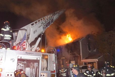 Firefighters battle a house fire on Waverly Avenue