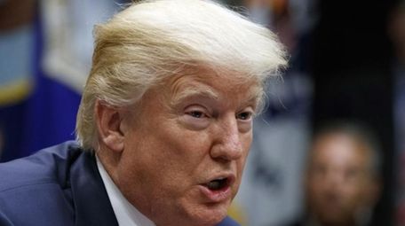 President Donald Trump speaks during a meeting in