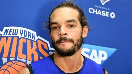 Joakim Noah speaks to the media after practice at