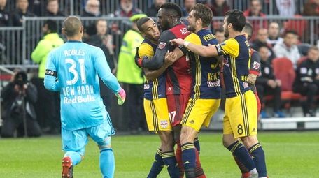 Toronto FC forward Jozy Altidore grapples with New