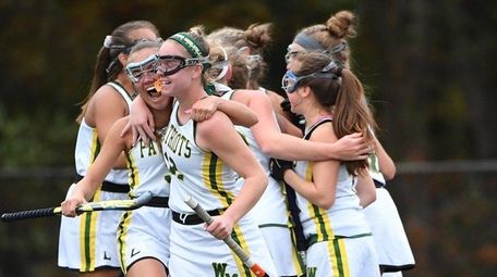 Ward Melville players celebrate a goal against Sachem East