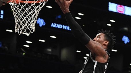Nets forward Rondae Hollis-Jefferson sinks a layup against