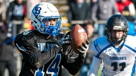 North Babylon's David Estrella hauls in a pass