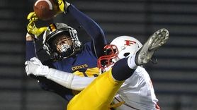 Owen Glascoe #88 of Massapequa, left, makes an