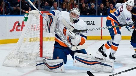 Islanders goaltender Thomas Greiss blocks a shot from the